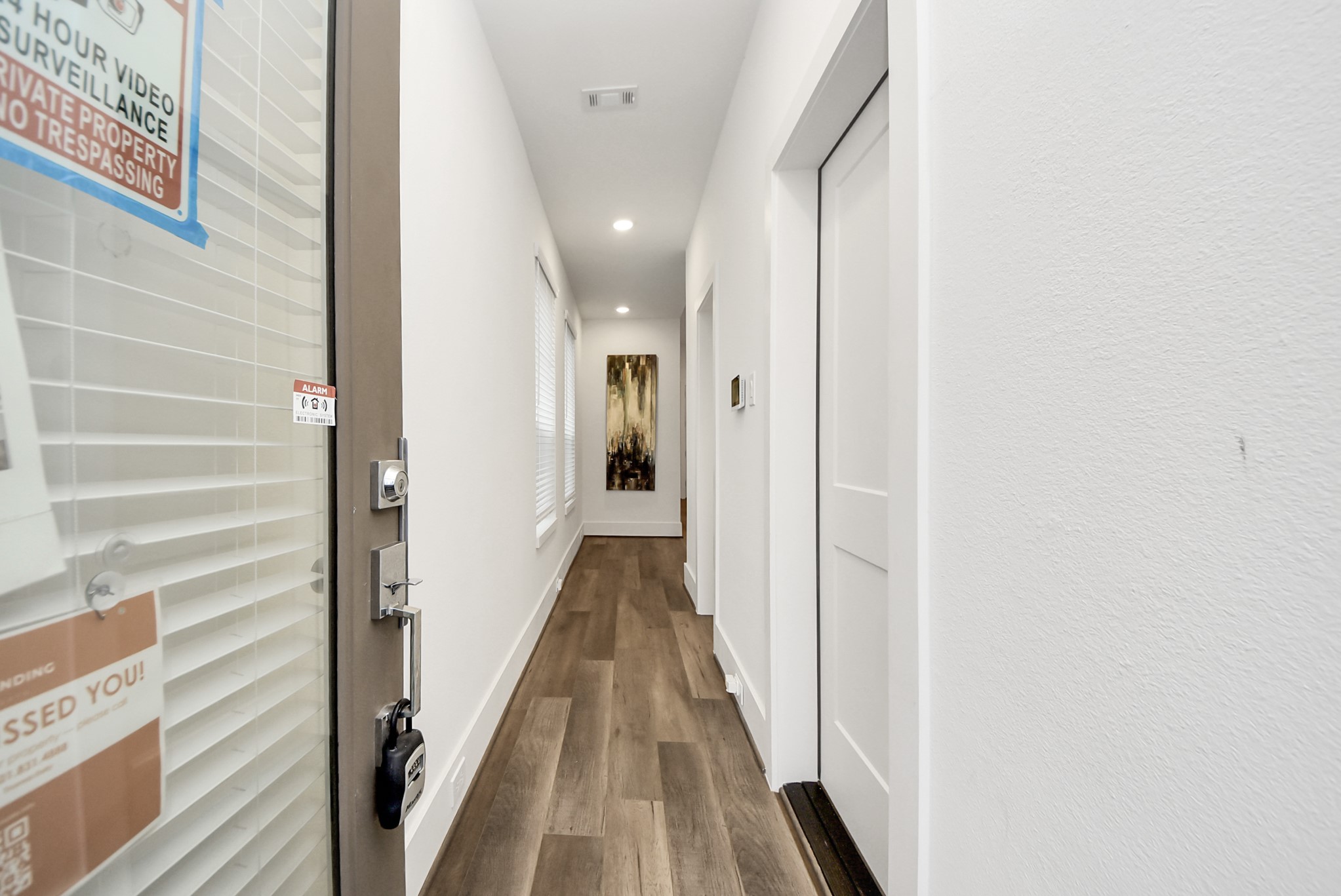 7502 Carver Road, Unit A Houston, TX 77088 - Photo 4 of 48 a view of a hallway with wooden floor and staircase