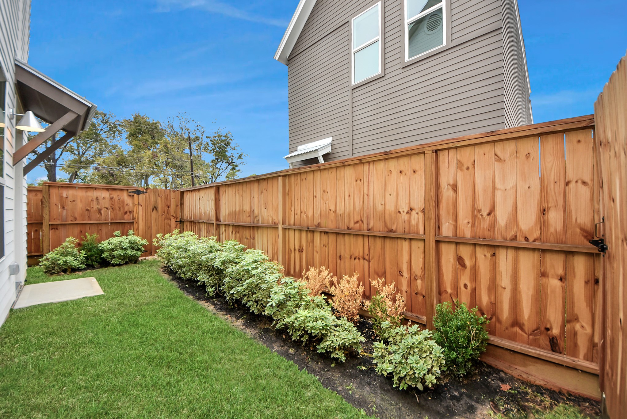 7502 Carver Road, Unit A Houston, TX 77088 - Photo 45 of 48 a view of a backyard with potted plants