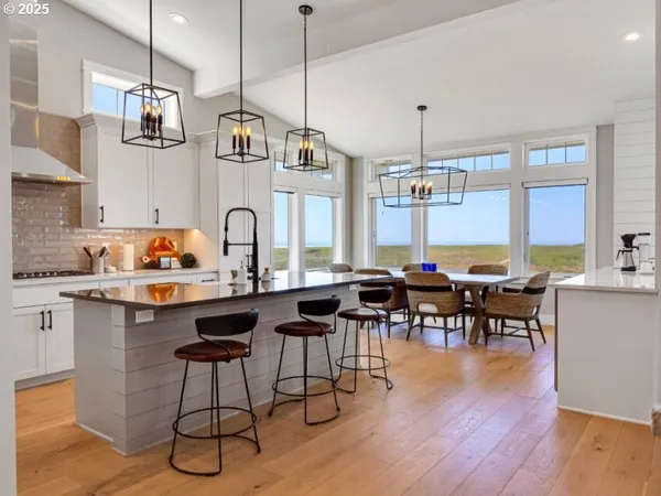 a open kitchen with sink and refrigerator
