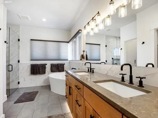 a bathroom with a sink double vanity and a mirror
