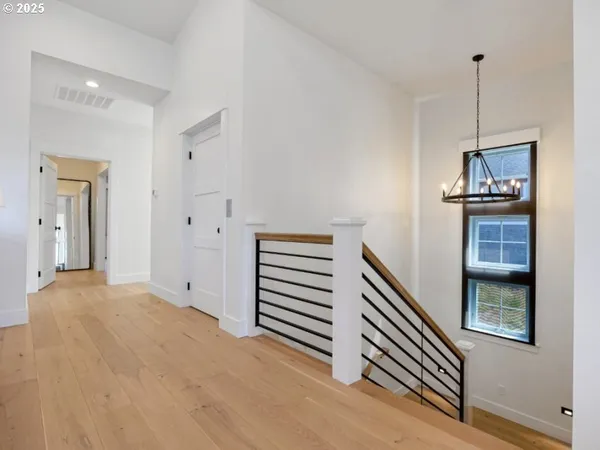 a view of a livingroom with furniture and staircase