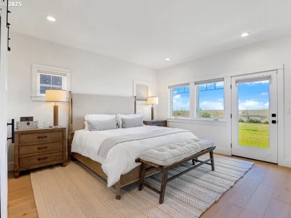 a bedroom with a bed and a view of kitchen