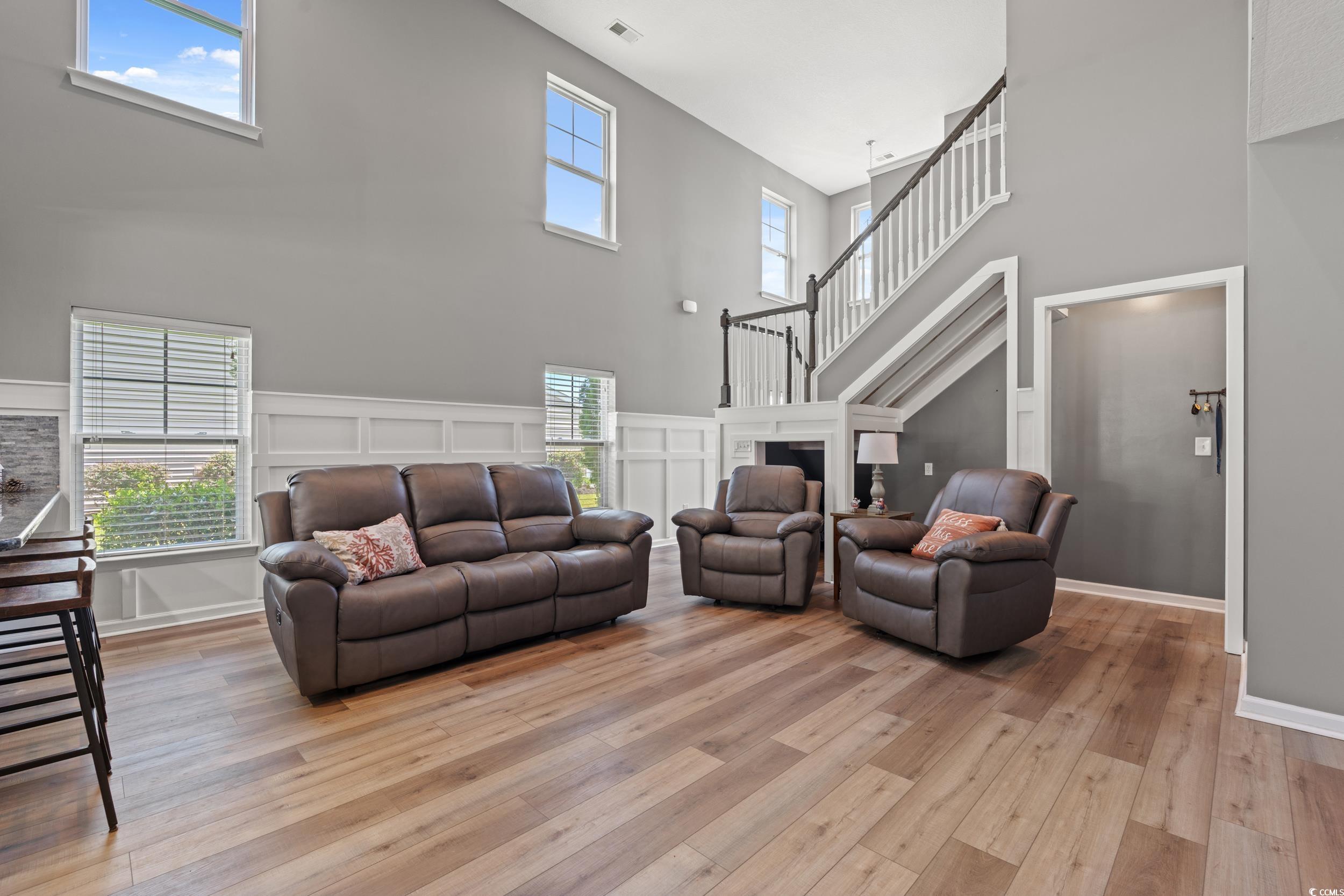 276 Whipple Run Loop Myrtle Beach, SC 29588 - Photo 11 of 40 Living area with a high ceiling, light wood finish