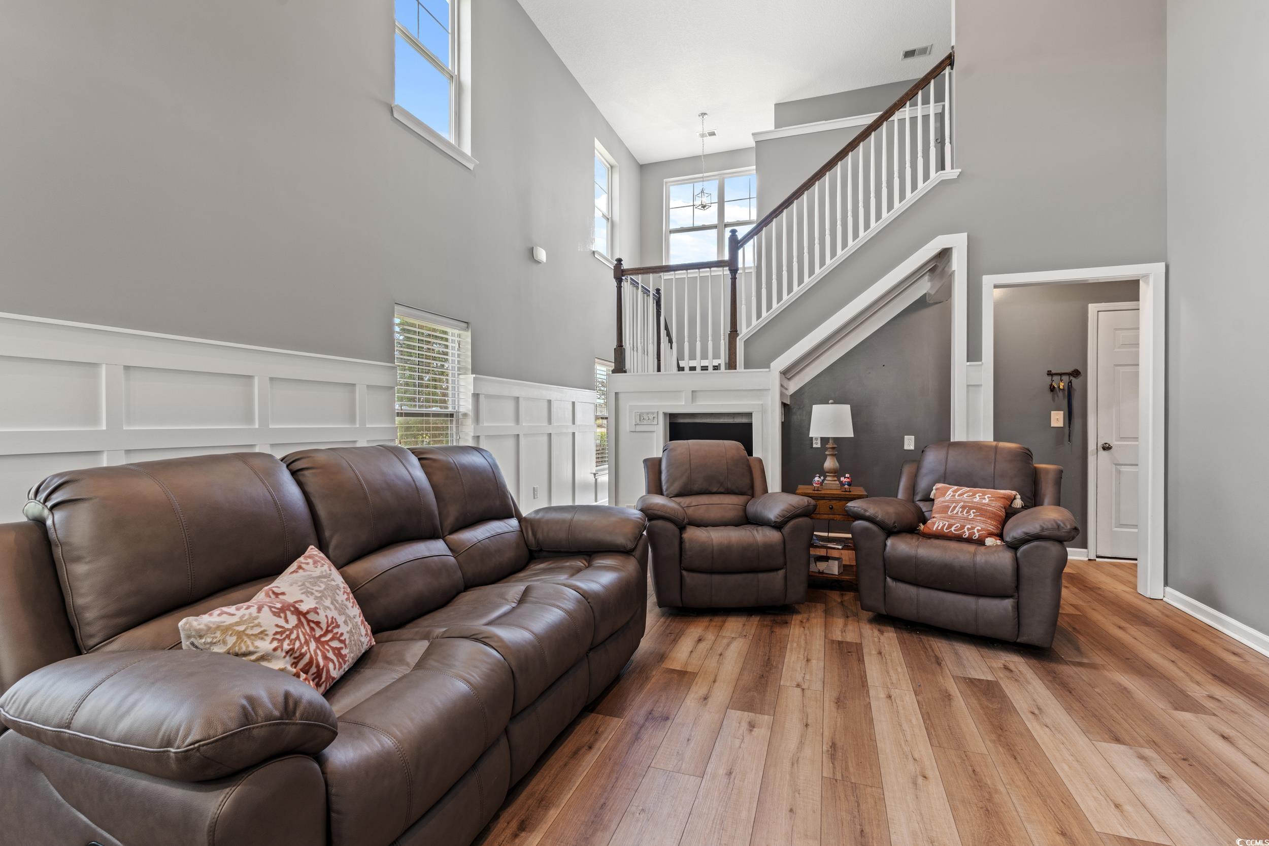 276 Whipple Run Loop Myrtle Beach, SC 29588 - Photo 12 of 40 Living room with a high ceiling, light wood-style