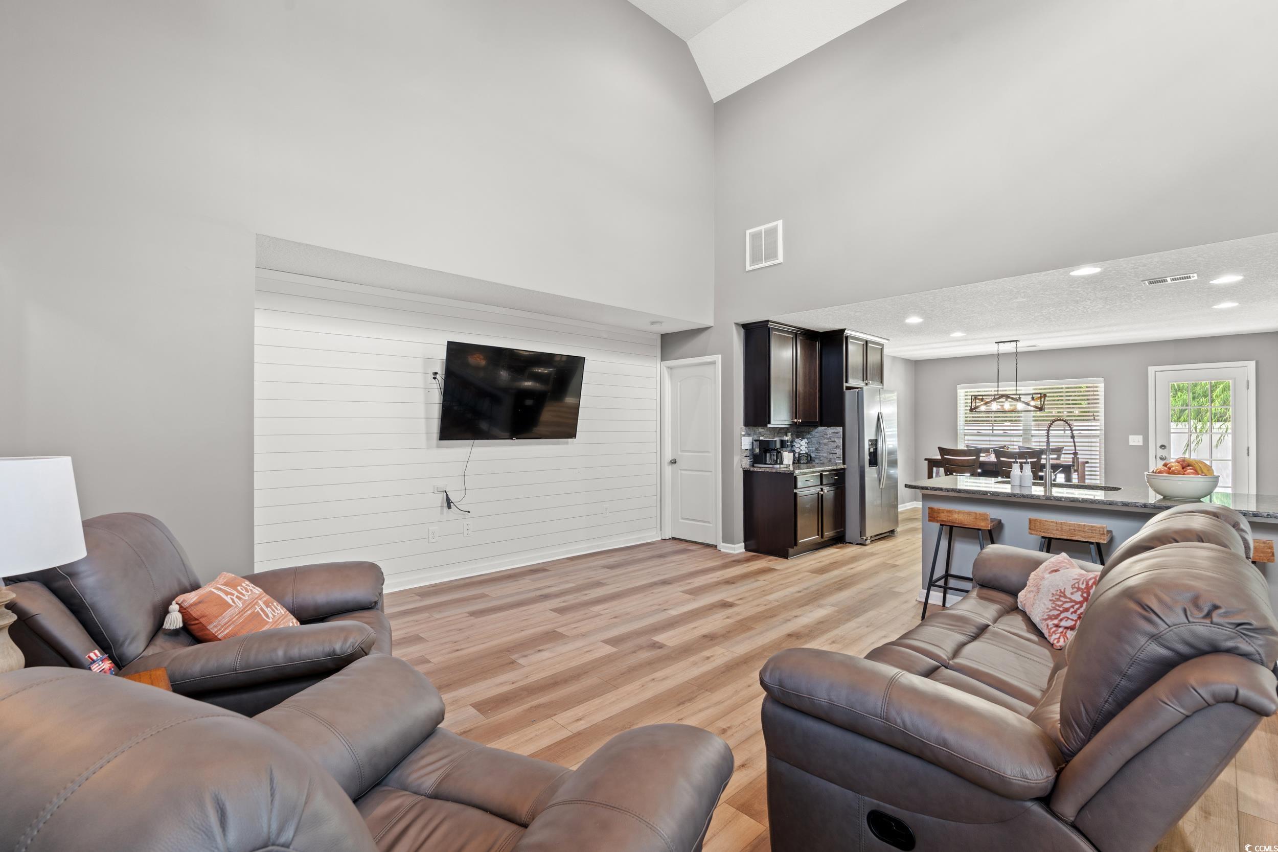 276 Whipple Run Loop Myrtle Beach, SC 29588 - Photo 14 of 40 Living room featuring light wood-style floors, lof