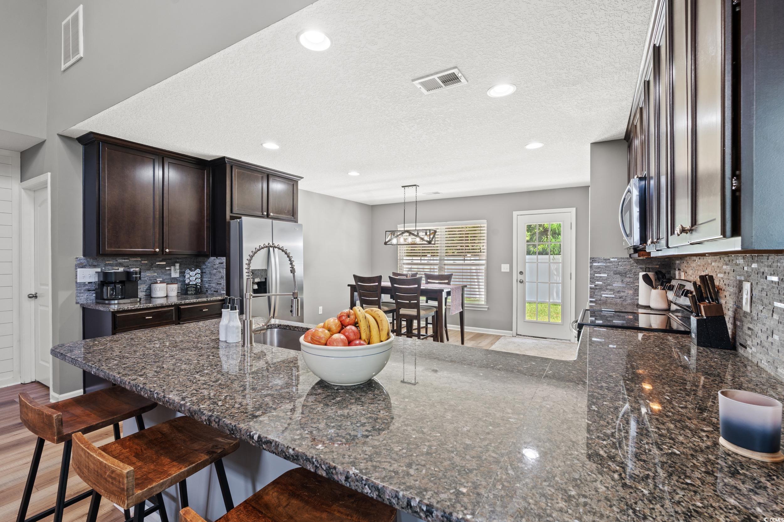 276 Whipple Run Loop Myrtle Beach, SC 29588 - Photo 15 of 40 Kitchen with stainless steel appliances, decorativ