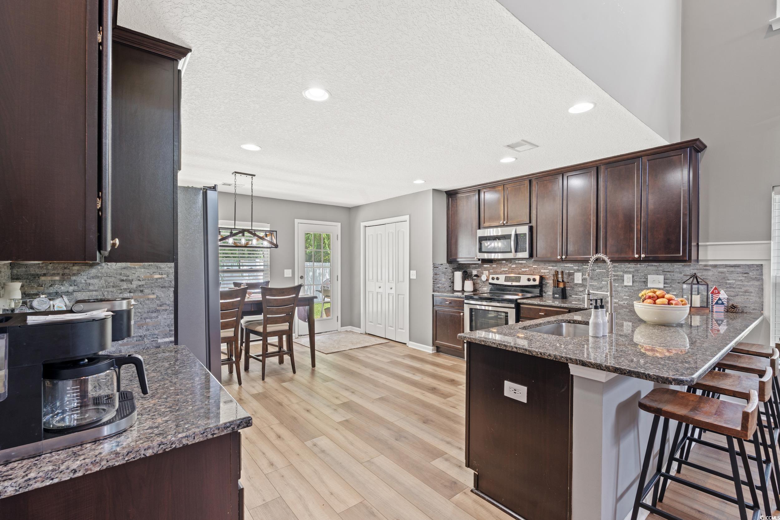 276 Whipple Run Loop Myrtle Beach, SC 29588 - Photo 16 of 40 Kitchen with stainless steel appliances, dark ston