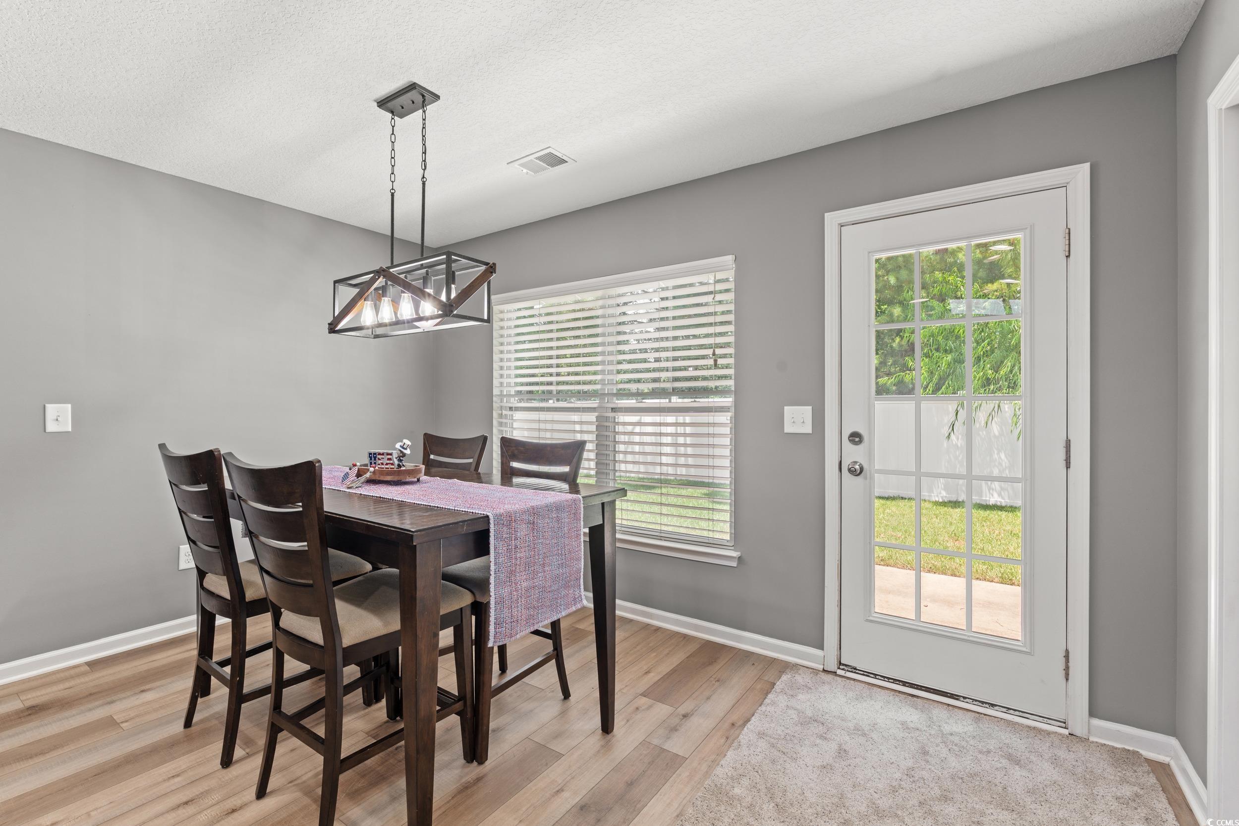 276 Whipple Run Loop Myrtle Beach, SC 29588 - Photo 20 of 40 Dining room with light wood-style flooring, plenty
