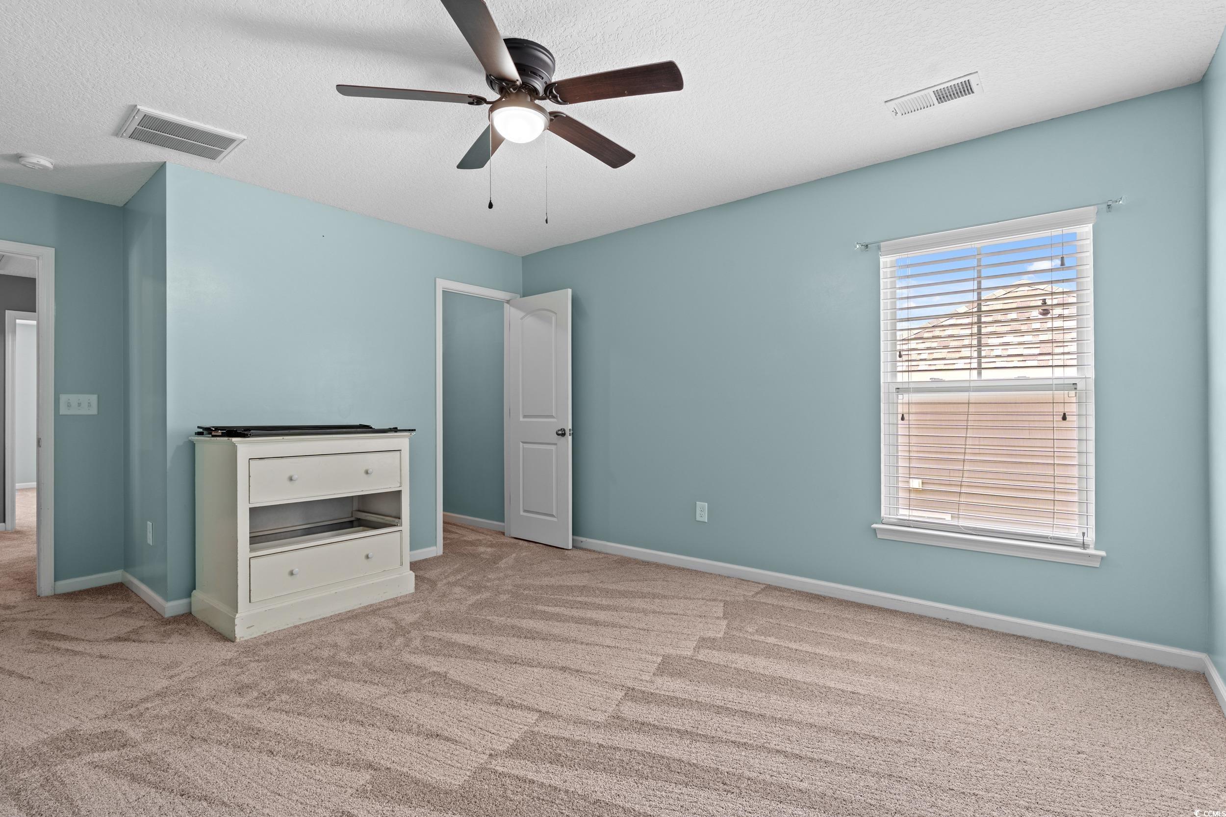 276 Whipple Run Loop Myrtle Beach, SC 29588 - Photo 30 of 40 Unfurnished bedroom with carpet flooring, a textur