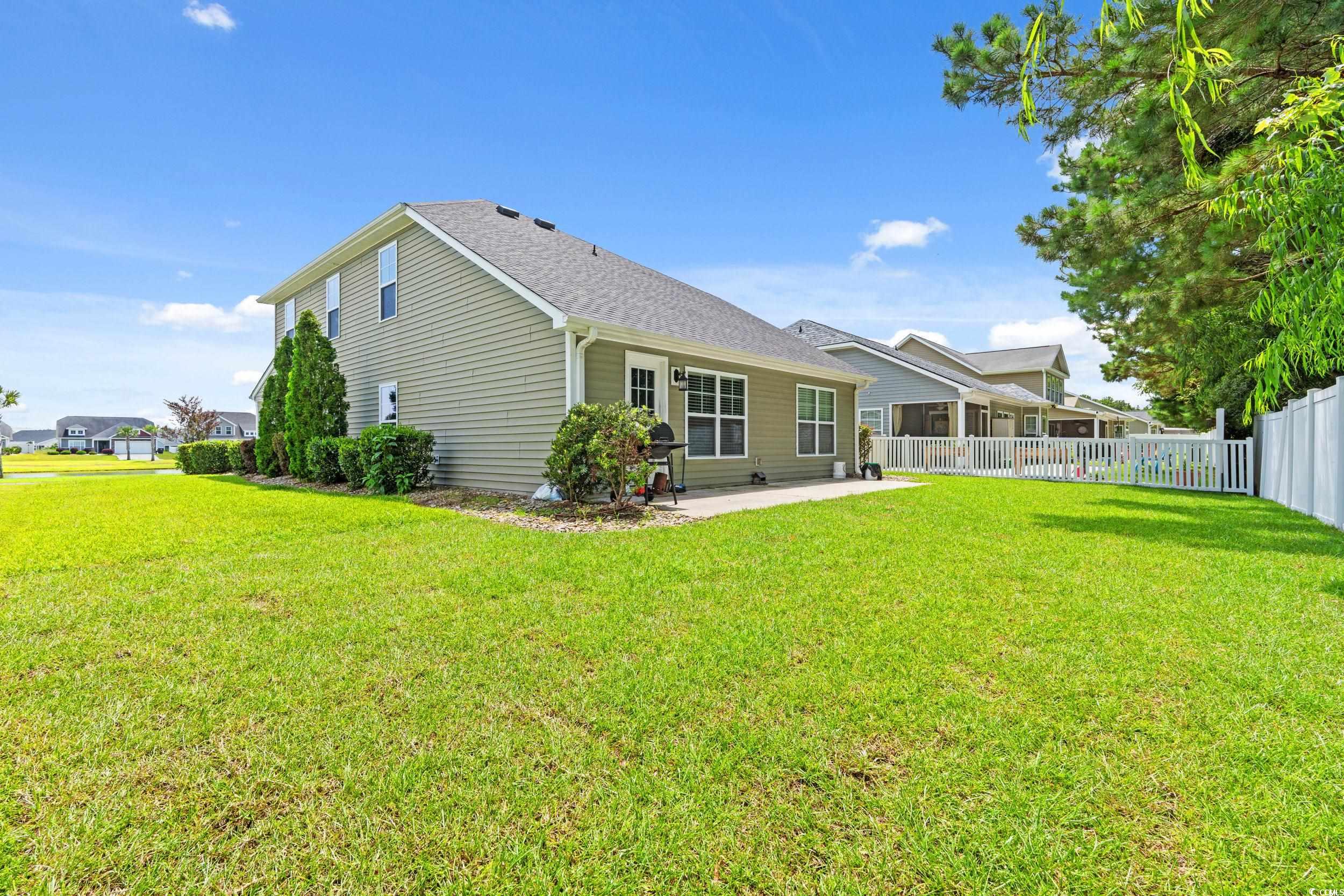 276 Whipple Run Loop Myrtle Beach, SC 29588 - Photo 5 of 40 Rear view of property featuring a patio area