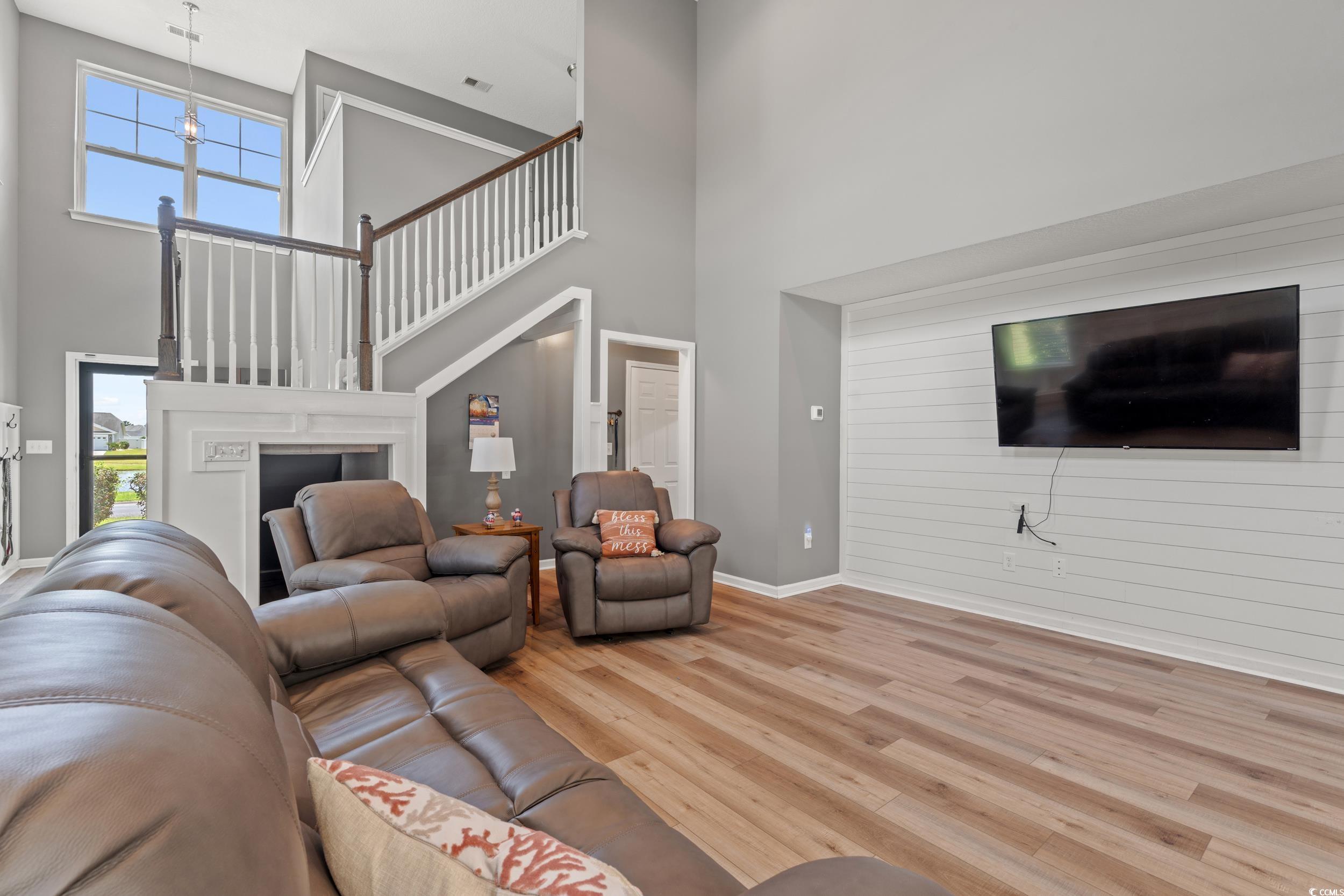 276 Whipple Run Loop Myrtle Beach, SC 29588 - Photo 10 of 40 Living area featuring a high ceiling, wood finishe
