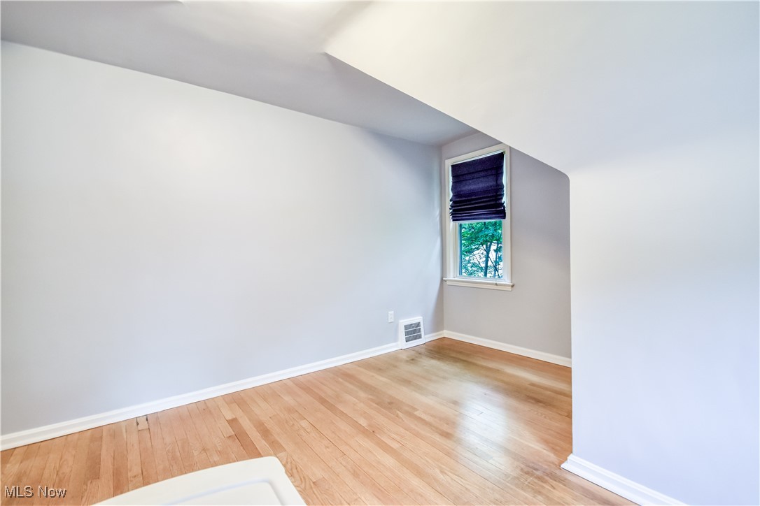 8115 Stockbridge Road Mentor, OH 44060 - Photo 29 of 46 Additional living space with baseboards and light wood-style flooring