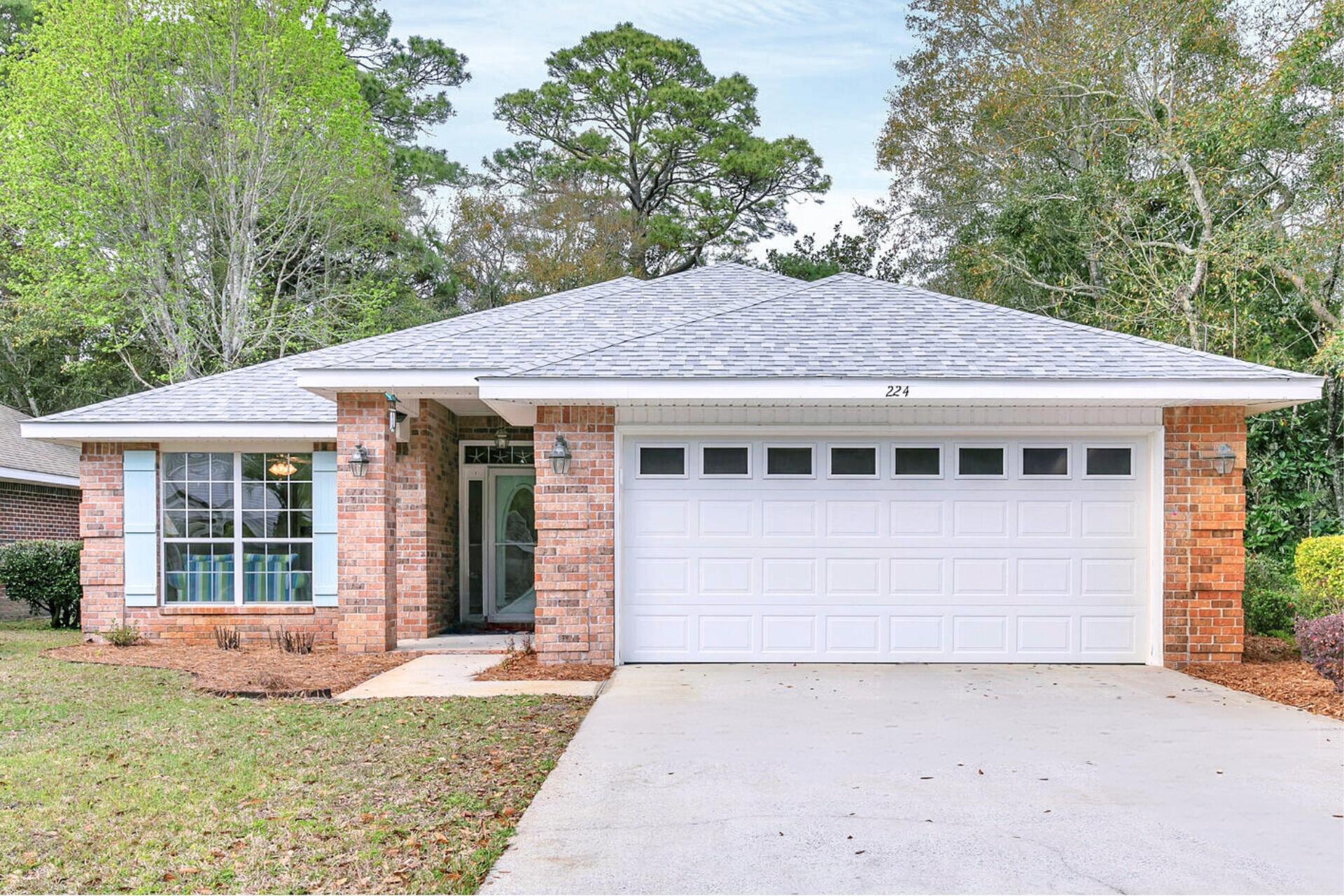 224 Bayou Landing Road Santa Rosa Beach, FL 32459 - Photo 1 of 25 a view of a house with a yard and potted plants