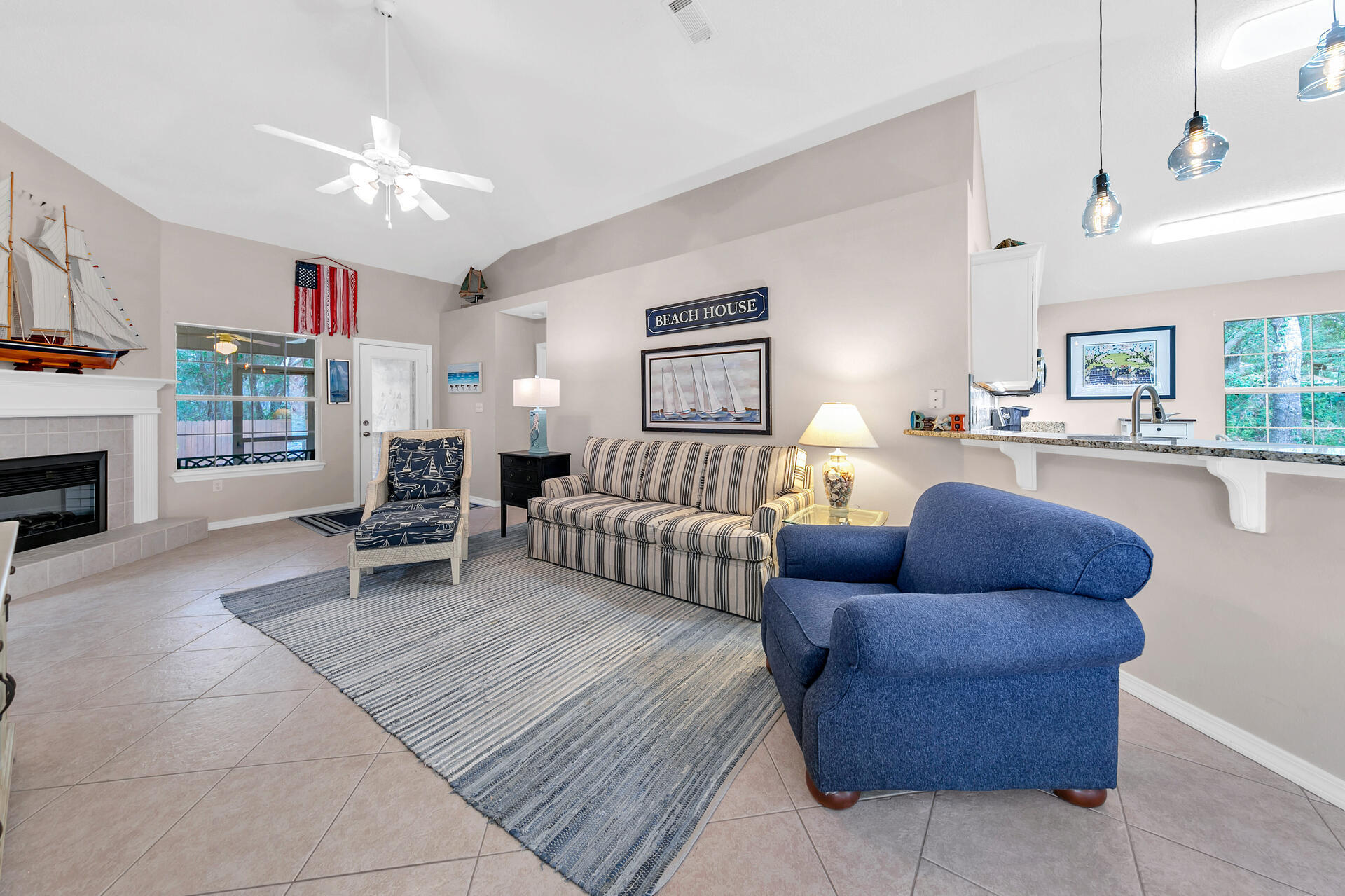 224 Bayou Landing Road Santa Rosa Beach, FL 32459 - Photo 23 of 25 a living room with furniture and a fireplace
