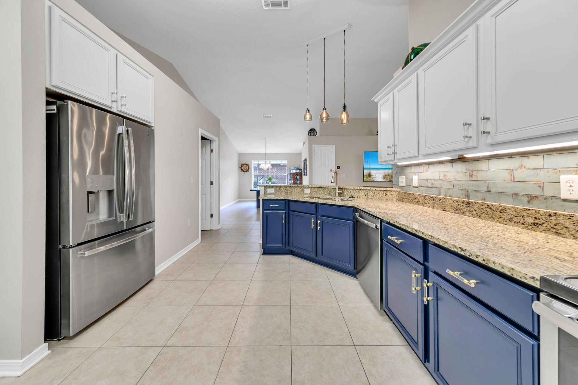 224 Bayou Landing Road Santa Rosa Beach, FL 32459 - Photo 6 of 25 a kitchen with stainless steel appliances granite countertop a refrigerator and a sink
