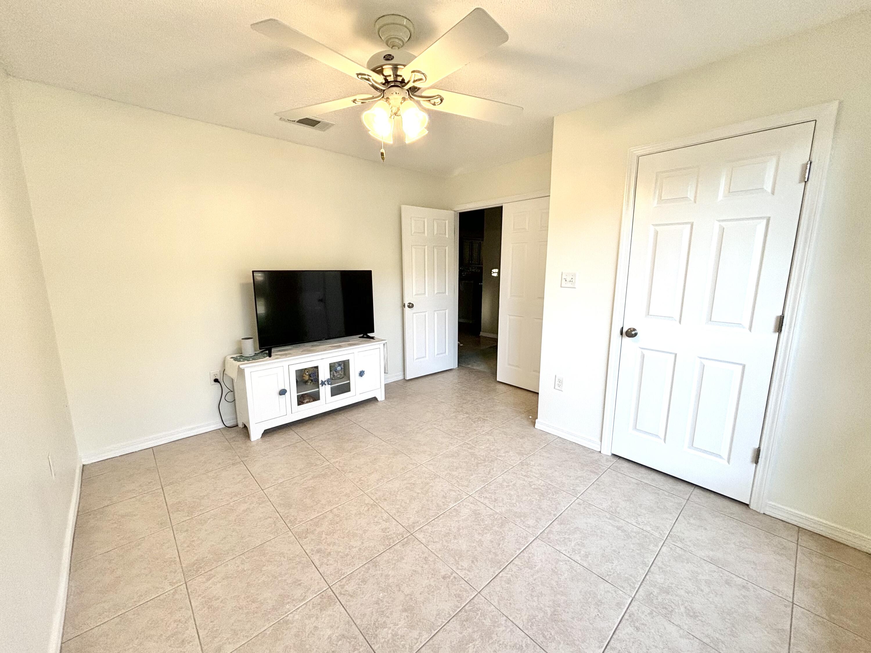 224 Bayou Landing Road Santa Rosa Beach, FL 32459 - Photo 9 of 25 a view of a livingroom with a flat screen tv