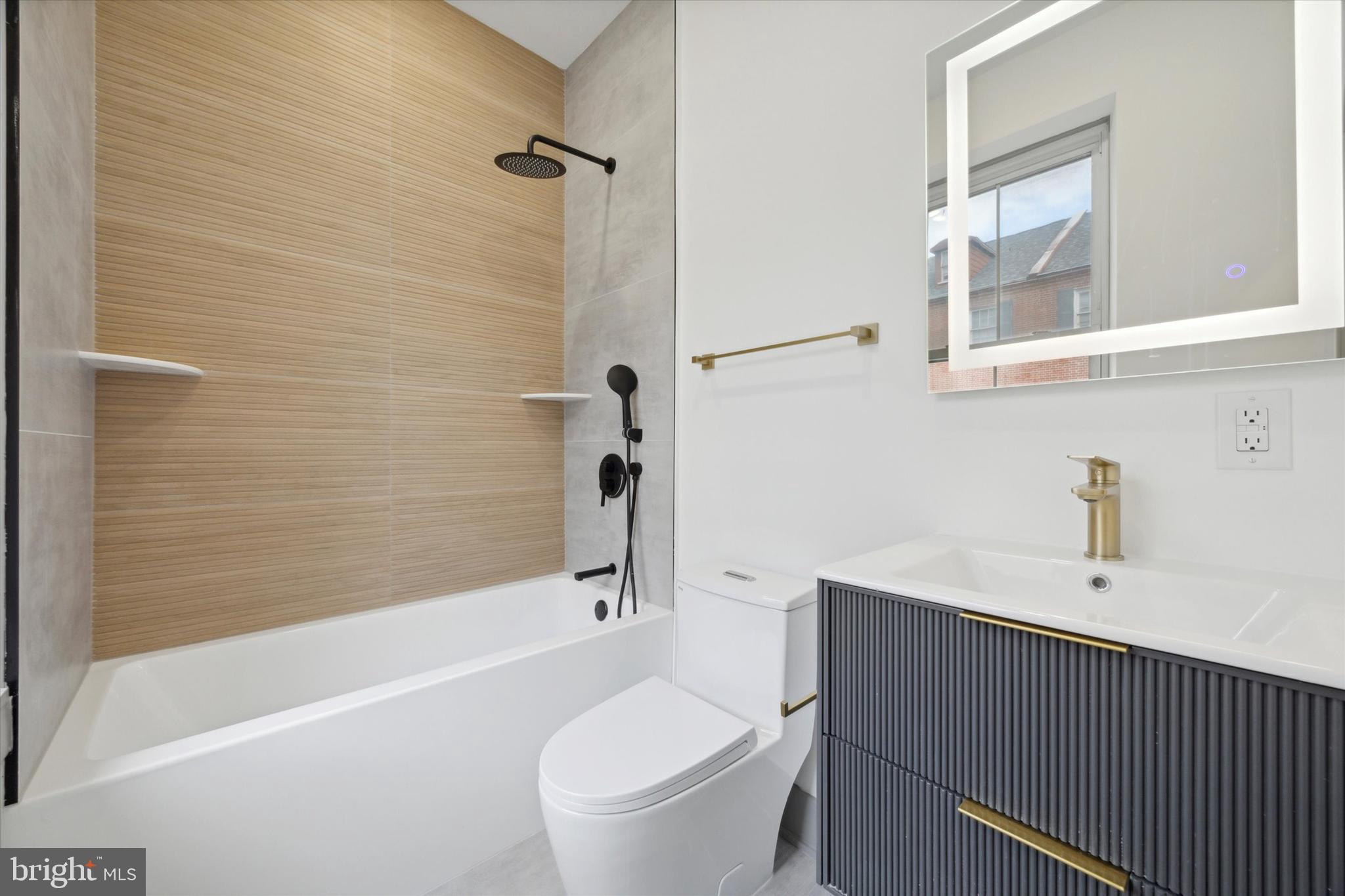 251 South 12th Street, Unit 2 Philadelphia, PA 19107 - Photo 9 of 10 a bathroom with a sink a toilet and a bathtub