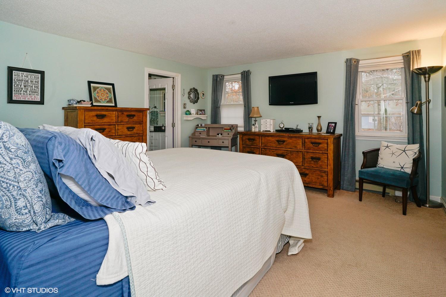 16 Foxglove Road Centerville, MA 02632 - Photo 11 of 15 a bedroom with furniture and a flat screen tv
