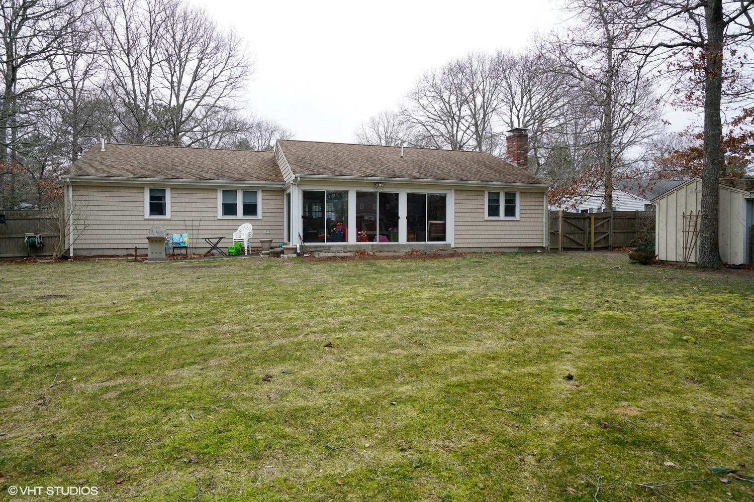 16 Foxglove Road Centerville, MA 02632 - Photo 14 of 15 a house that has a tree in front of it