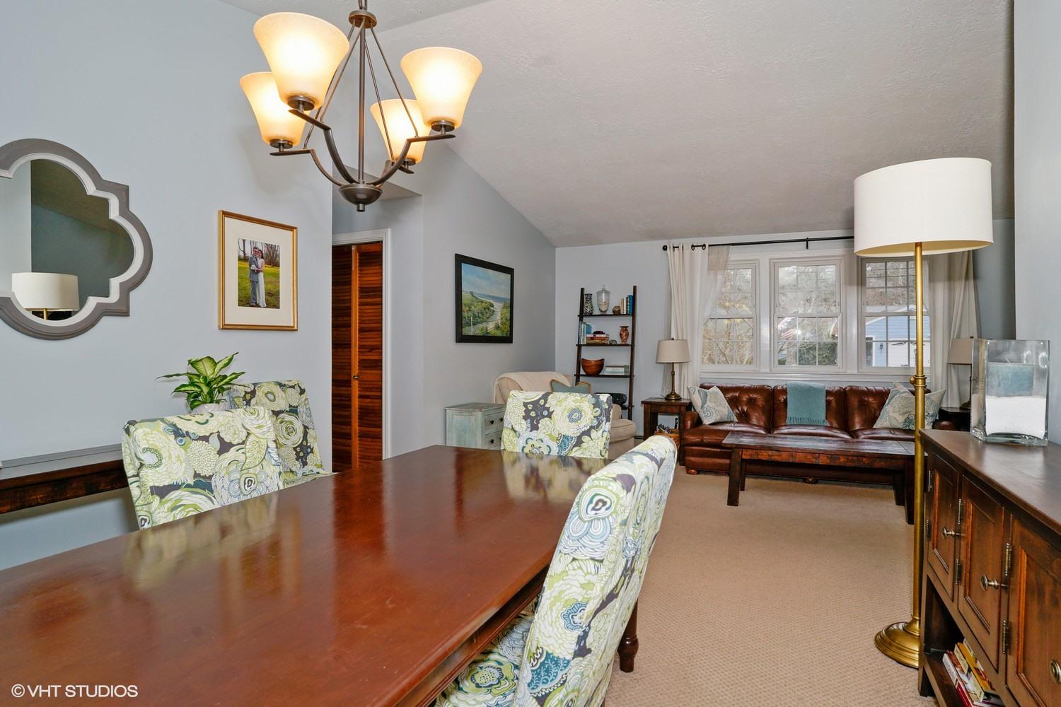 16 Foxglove Road Centerville, MA 02632 - Photo 4 of 15 a living room with furniture chandelier and a large window