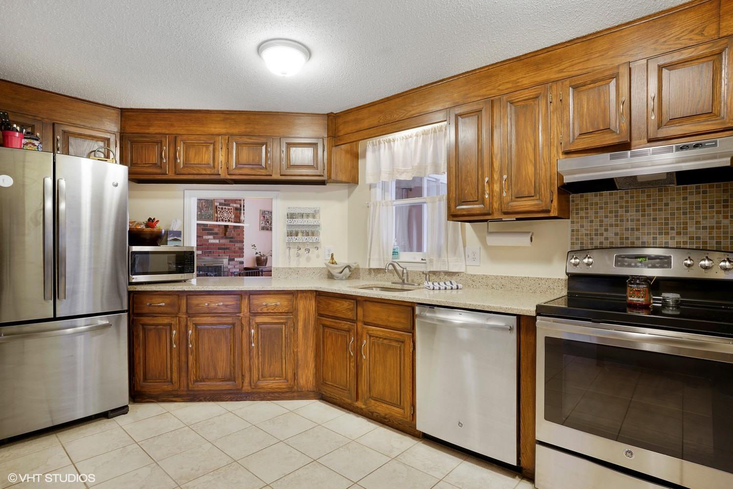 16 Foxglove Road Centerville, MA 02632 - Photo 6 of 15 a kitchen with stainless steel appliances granite countertop a refrigerator and stove