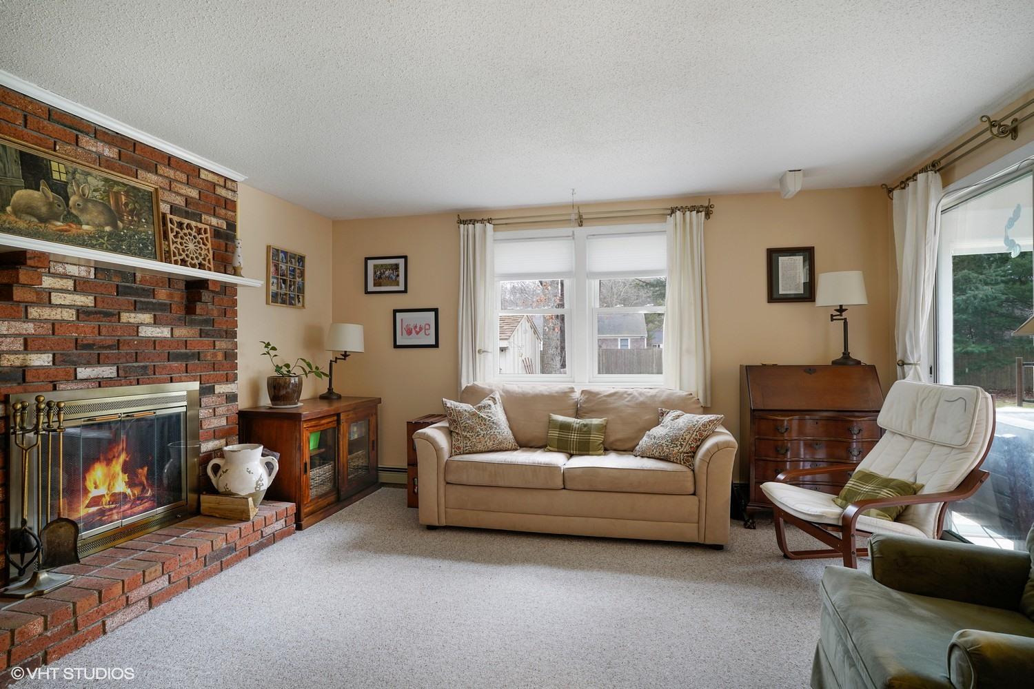16 Foxglove Road Centerville, MA 02632 - Photo 7 of 15 a living room with furniture and a fireplace
