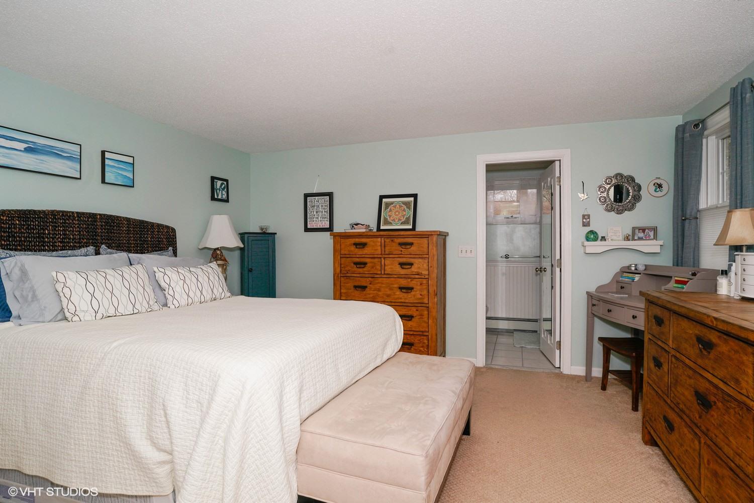 16 Foxglove Road Centerville, MA 02632 - Photo 10 of 15 a bedroom with a bed and a dresser