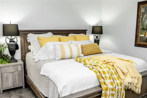 a bedroom with a bed and a tv