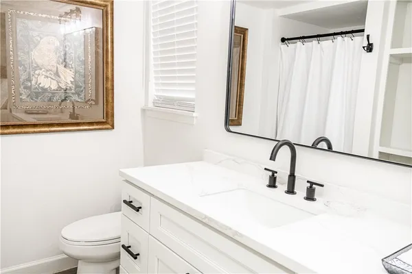 a bathroom with a sink and a toilet