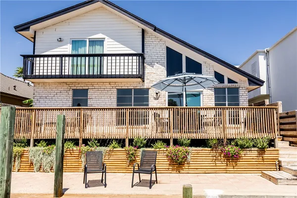 a terrace of a house with outdoor seating