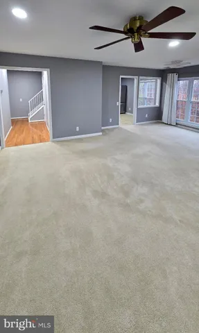 a view of a livingroom with a ceiling fan