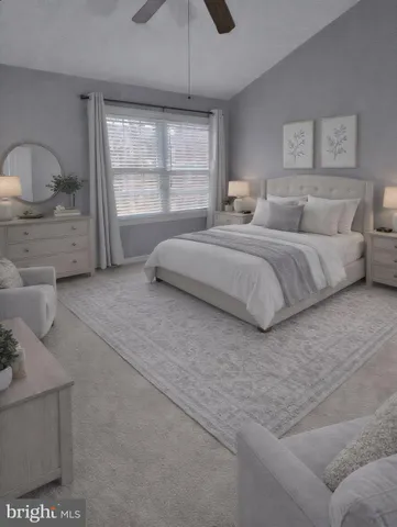 a spacious bedroom with a bed and a window