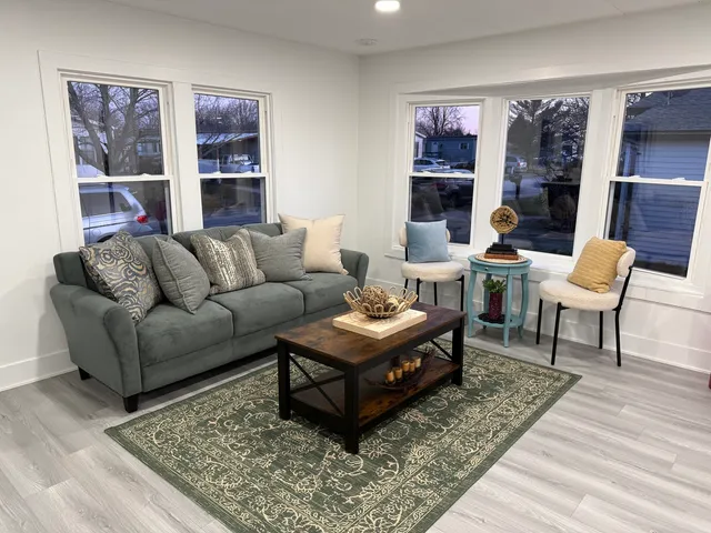 a living room with furniture and a rug