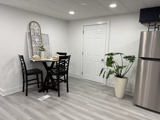 a view of a dining room with furniture window and wooden floor