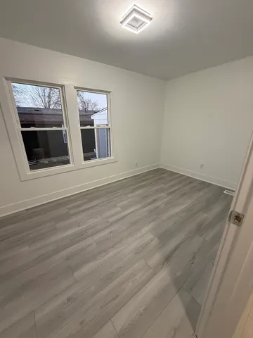 an empty room with a wooden floor