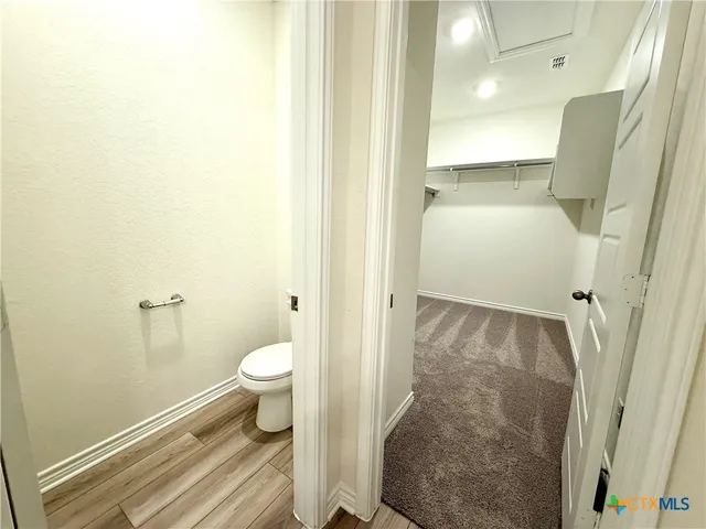 a view of a bathroom with a glass door and a shower