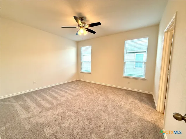 a spacious bathroom with a sink mirror and a shower