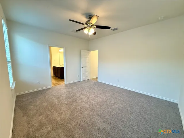 a bathroom with a sink vanity granite tub and shower