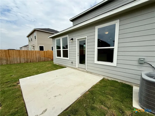 a view of a back yard of the house
