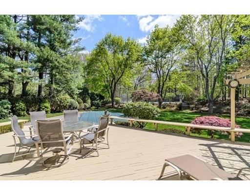 7 Russell Road Needham, MA 02492 - Photo 3 of 8 a view of a patio with table and chairs and potted plants
