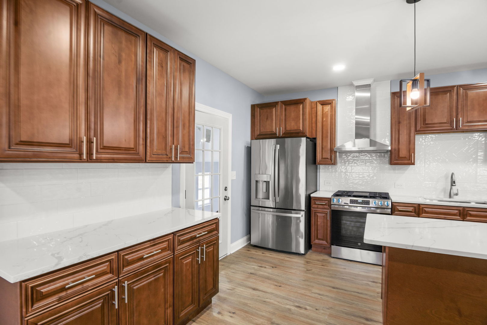 2402 North 41st Road Sheridan, IL 60551 - Photo 12 of 30 a kitchen with stainless steel appliances granite countertop a refrigerator stove and sink