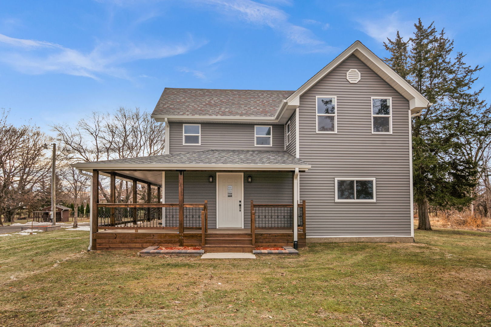 2402 North 41st Road Sheridan, IL 60551 - Photo 2 of 30 a front view of a house with a garden