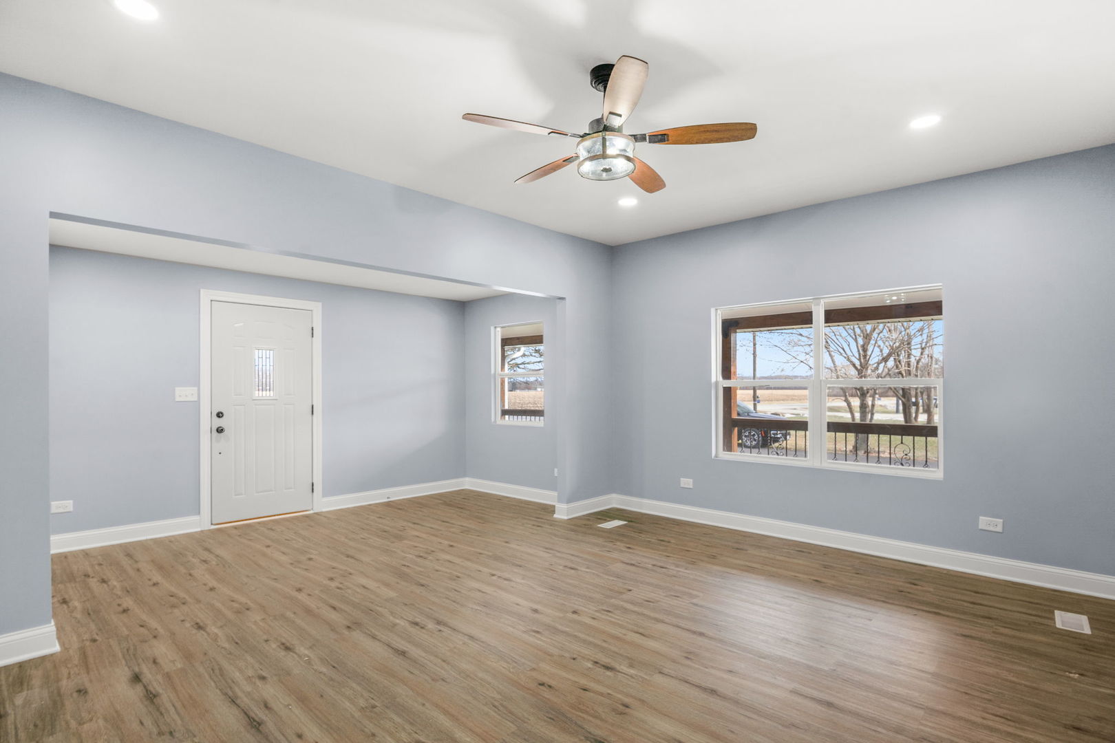 2402 North 41st Road Sheridan, IL 60551 - Photo 9 of 30 a view of an empty room with wooden floor and a window