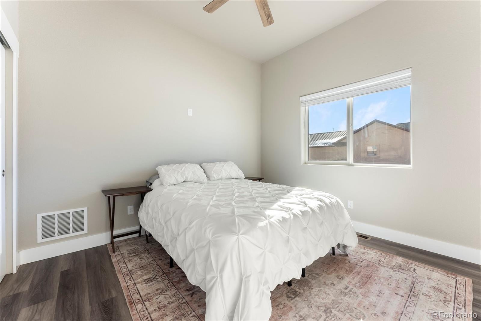 489 Duesouth Road Florissant, CO 80816 - Photo 21 of 40 a bed sitting in a bedroom next to a window