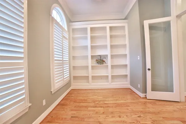 a view of an empty room and a window