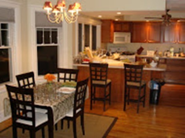 6 Russell Road, Unit 6 Winchester, MA 01890 - Photo 3 of 30 a view of a dining room with furniture and wooden floor