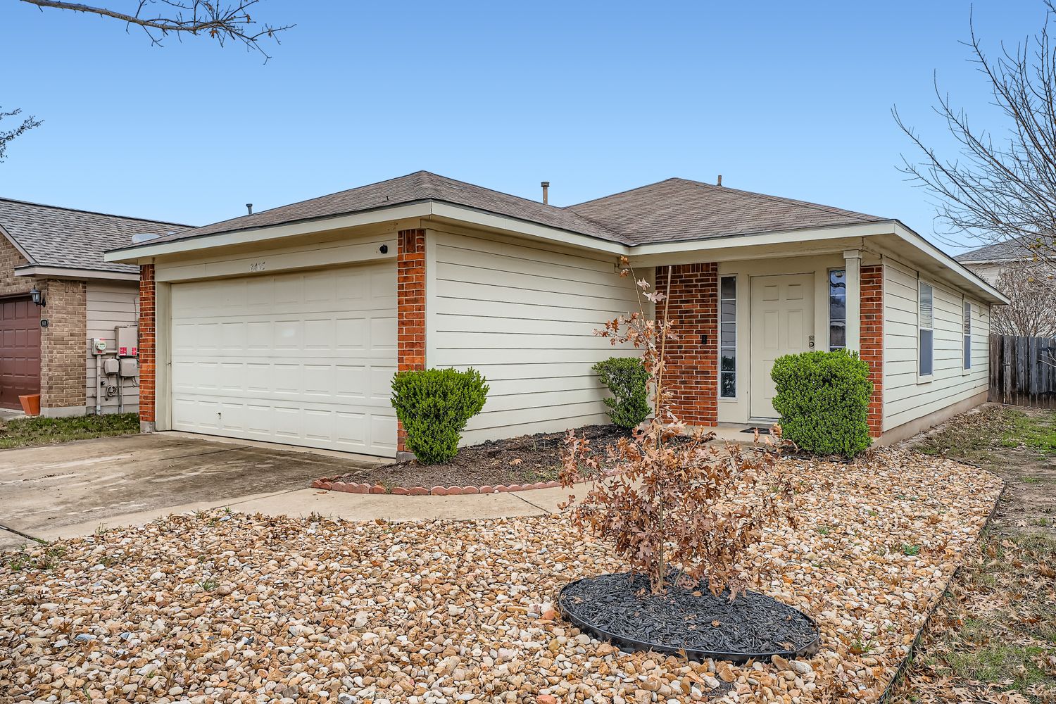 a view of a house with a small yard and plants