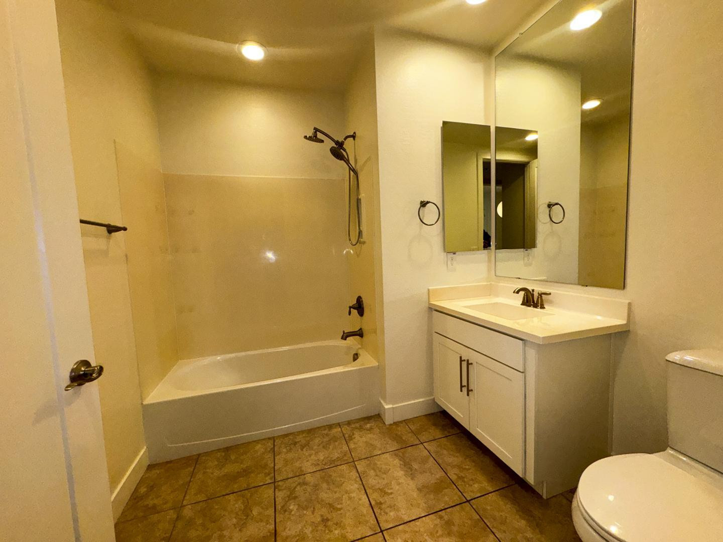 6565 East Thomas Road, Unit 1046 Scottsdale, AZ 85251 - Photo 11 of 16 a bathroom with a sink mirror vanity and toilet