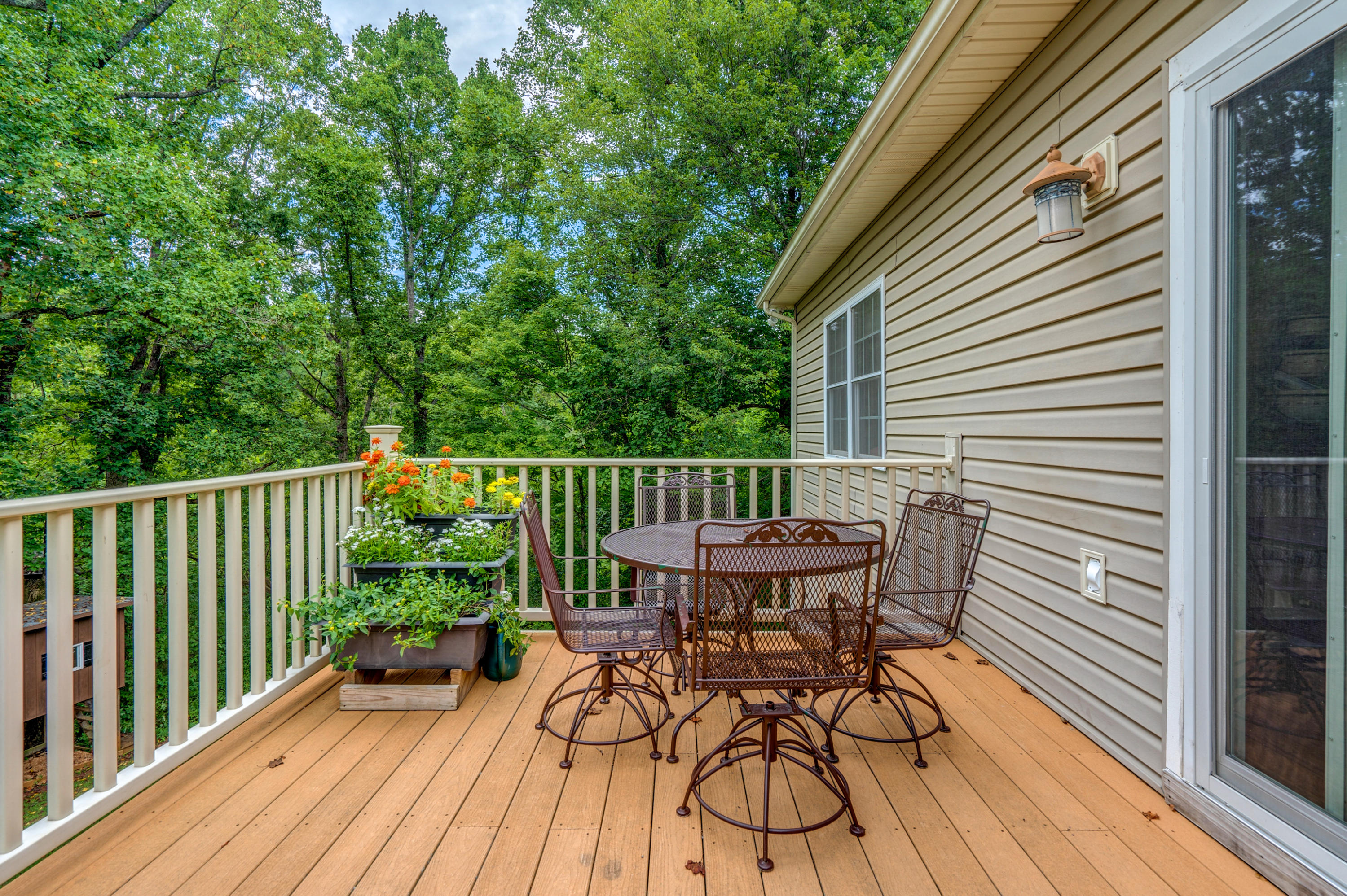 1205 Summit View Road Goodview, VA 24095 - Photo 13 of 46 a view of a chair and table on the wooden deck