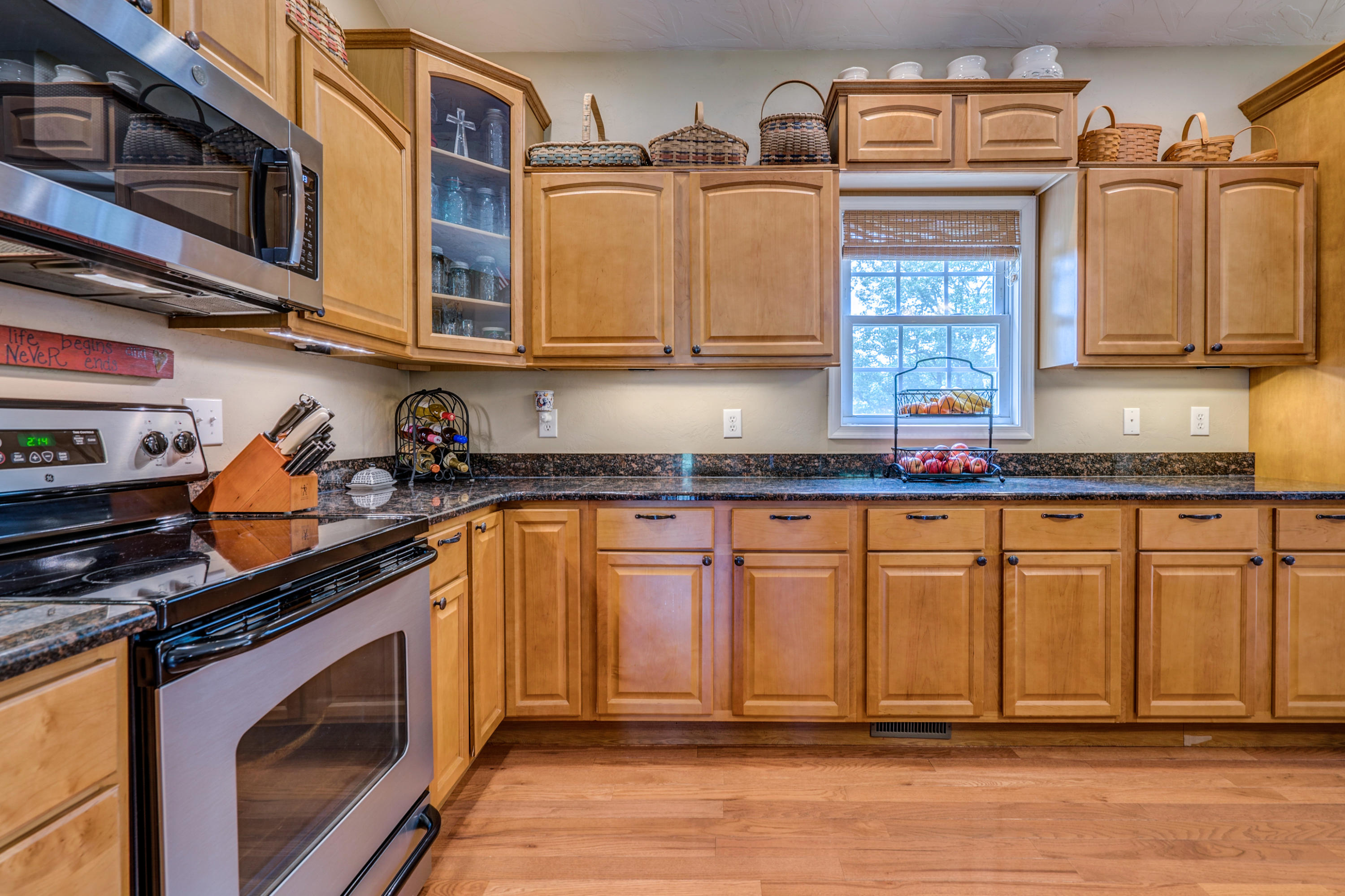 1205 Summit View Road Goodview, VA 24095 - Photo 16 of 46 a kitchen with stainless steel appliances granite countertop a sink a stove and cabinets